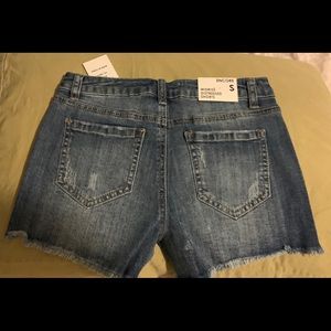 A medium wash Denim shorts Light denim Distressed